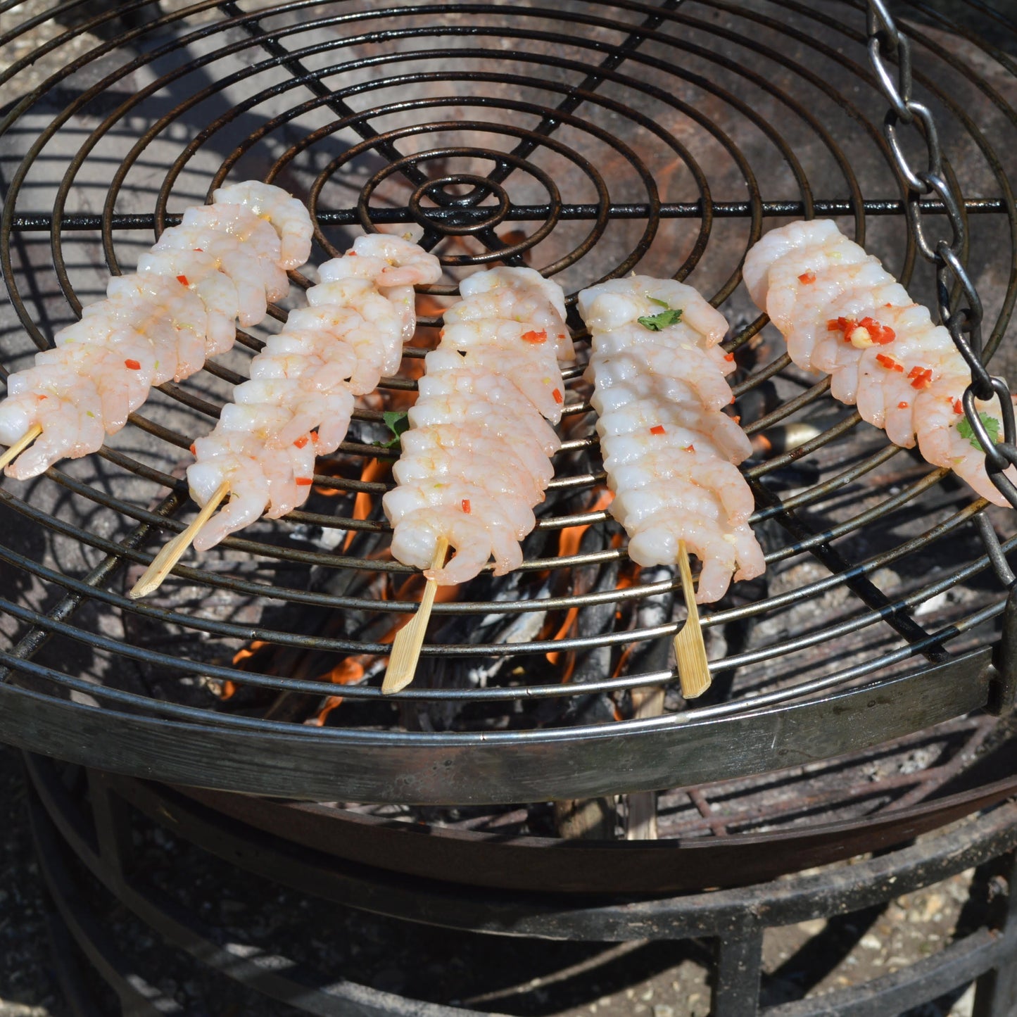 Raw Peeled Prawns On Bamboo Skewers