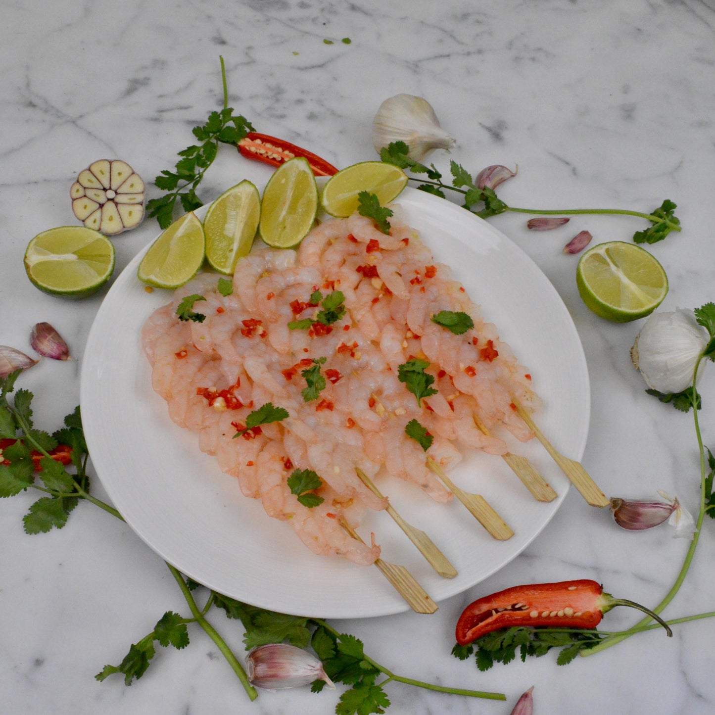 Raw Peeled Prawns On Bamboo Skewers