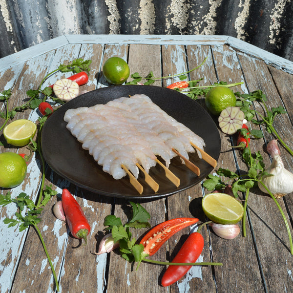 Raw Peeled Prawns On Bamboo Skewers